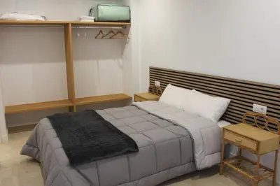 a bedroom with a large bed in a room at XELIÑA c in A Estrada