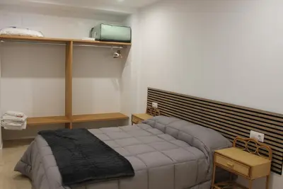 a bedroom with a bed in a room at XELIÑA c in A Estrada