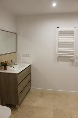 a bathroom with a sink and a mirror at XELIÑA c in A Estrada