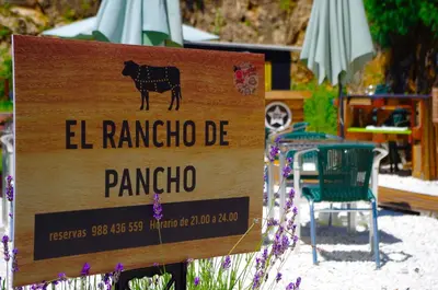 a sign that reads el rancho pampo with a cow on it at Hotel Rock Star in Taboadela
