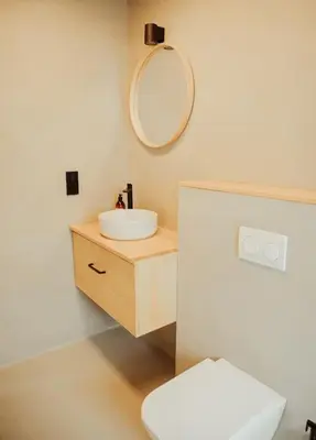 a white bathroom with a sink and a mirror at Casa de Covés in Puentedeume