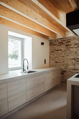 a kitchen with a sink and a window at Casa de Covés in Puentedeume