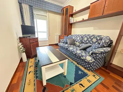 a living room with a couch and a table at Balcón da Habana in Ourense