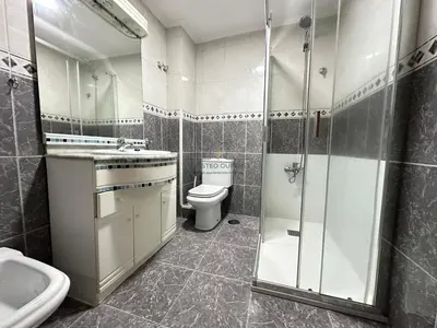 a bathroom with a toilet and a sink and a shower at Balcón da Habana in Ourense