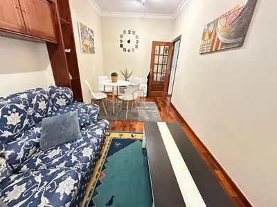 a living room with a couch and a table at Balcón da Habana in Ourense