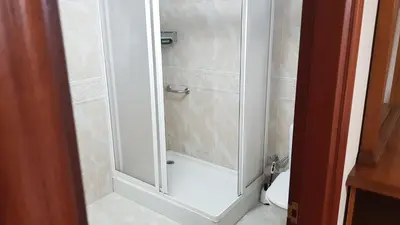 a shower with a glass door in a bathroom at CASA LOZANO in Barreiros