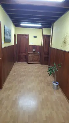 a large room with a potted plant in the middle at CASA LOZANO in Barreiros