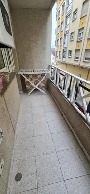 a balcony of a building with a metal railing at Piso Ainoa Playa de Covas in Viveiro