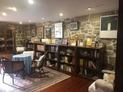 a living room with three couches and a table at La Casona RibeiraSacra in Moreiras