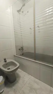 a bathroom with a toilet and a shower and a sink at Medorra in Ourense