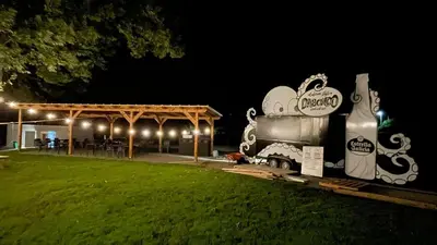 a food truck parked next to a pavilion at night at EcoCamp San Román by SuitesNature in Lugo