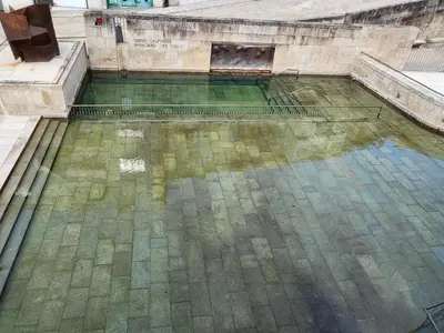 an empty pool of water in a building at Décimo Vera in Ourense