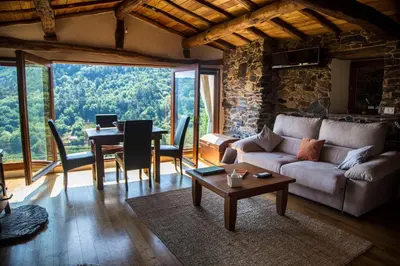 a living room with a couch and a table at Cabo Do Mundo Casa Rural in Chantada