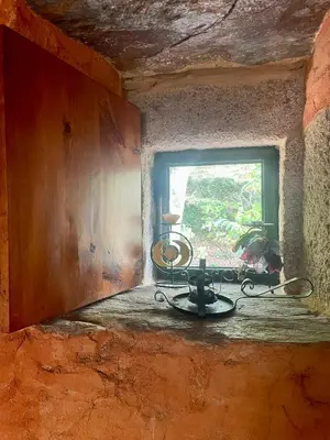 a window in a room with a table and a window at Casa Redonda in Ourense