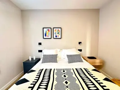 a bedroom with a large bed with two pillows at Os Potes Bajo in Ares