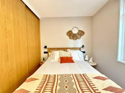 a bedroom with a large bed in a room at Os Potes Bajo in Ares