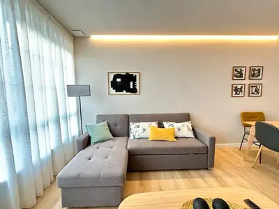a living room with a couch and a table at Os Potes Flat in Ares