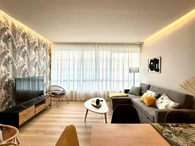 a living room with a couch and a tv at Os Potes Flat in Ares