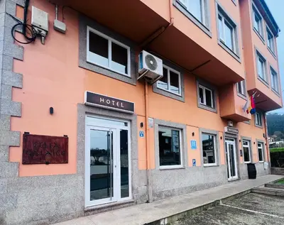 a building with a hotel sign on the side of it at Hotel Celta Galaico in Viveiro