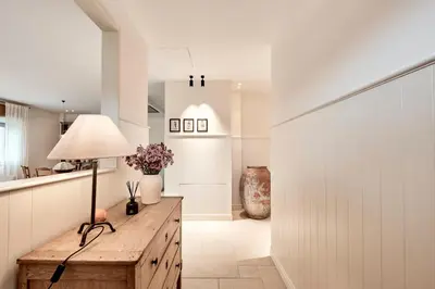 a kitchen and dining room with a table and chairs at Casa Das Ferreñas in Melide