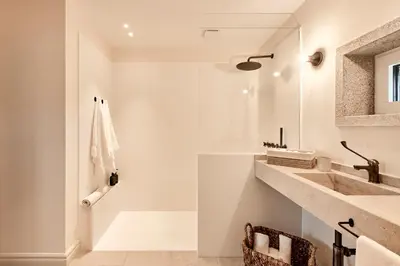 a white bathroom with a sink and a shower at Casa Do Gaiteiro in Melide
