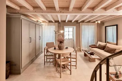 a kitchen with white cabinets and a counter top at Casa Juanita in Melide