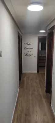 a room with a hallway with a hard wood floor at Cómo en casa Villablino in Villablino