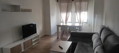 a living room with a couch and a flat screen tv at Cómo en casa Villablino in Villablino