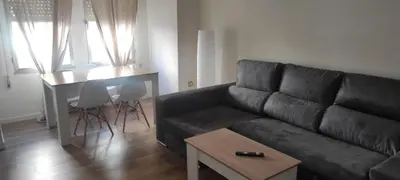 a living room with a couch and a table at Cómo en casa Villablino in Villablino