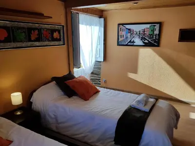 a hotel room with a bed and a window at Aqua Rooms Sarria in Sarria