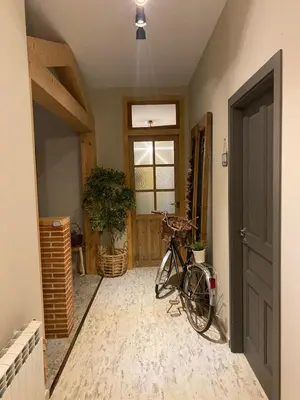 a bike parked in a room with a door at As Miguiñas do Cebreiro in Piedrafita