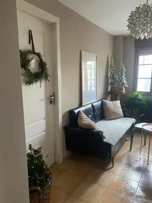 a living room with a couch and a table at As Miguiñas do Cebreiro in Piedrafita