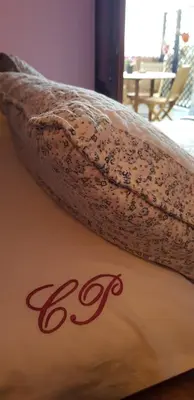 a long piece of fabric sitting on top of a bed at Apartamentos Rurales Casa Pachona in Puerto de Vega