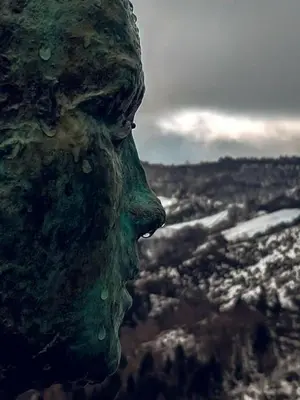 a statue of a face with water drops on it at Casa Antón O Cebreiro in O Cebreiro