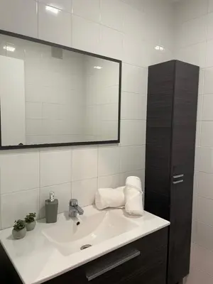 a bathroom with a sink and a mirror at Joaquín Potel in Caldas de Reis