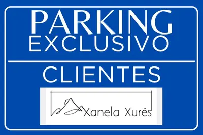 a set of signs with the words parking inclusive elements at Xanela Xures in Muiños
