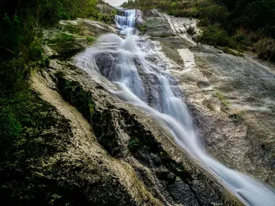 a waterfall on the side of a mountain at Mirador do Xistral in Valle de Oro