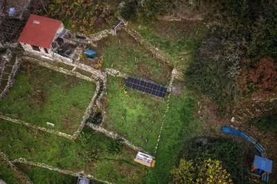 an aerial view of a garden with a solar panel at cabaña do rei in Betán