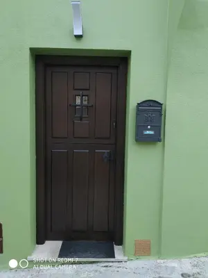 a bedroom with a bed and a dresser and a chair at Casa Rural de alquiler integro La Cantina de Villarmayor-Asturias in Villarmayor