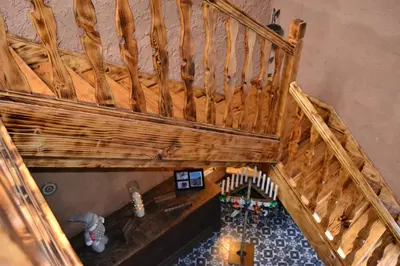 an overhead view of a room with a wooden stairs at El Trasgu de Foncebadón in Foncebadón