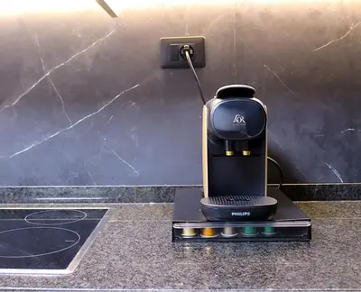 a coffee maker sitting on top of a counter at Golden Home in Ourense