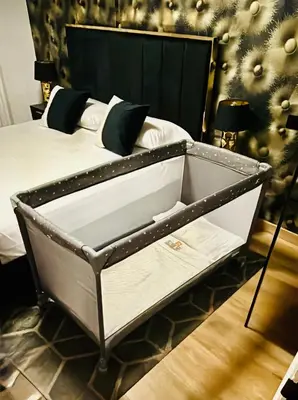 a bed with a black and white bed frame at Golden Home in Ourense