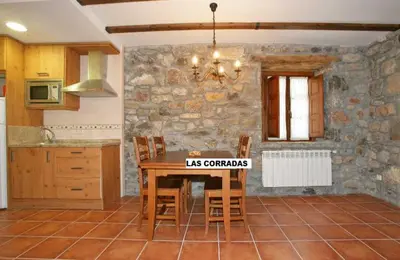 a building with snow on the roof of it at Casas Rurales Las Corradas in Éndriga
