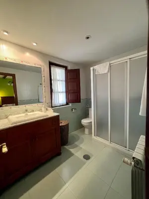 a bathroom with a sink and a mirror at Casas Rurales Las Corradas in Éndriga