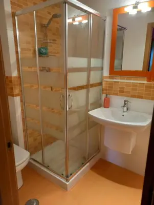 a bathroom with a shower and a sink at Dúplex Entero en Foz in Foz