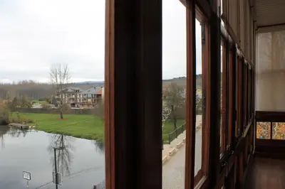 a window view of a river from a house at Hotel Miralrio Cacabelos in Cacabelos