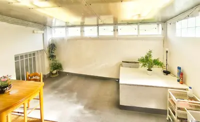 an empty room with a table and some plants at Apartamento en Betanzos in Betanzos