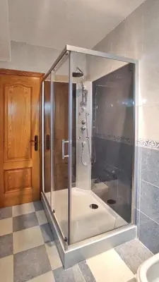 a shower with a glass door in a bathroom at Apartamento en Betanzos in Betanzos