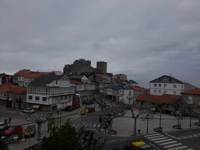 a town with a castle in the background at O Lar do Rodrigo in Castro Caldelas