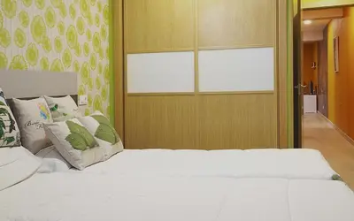 a bedroom with a white bed and a window at Aire de Sanabria in El Puente